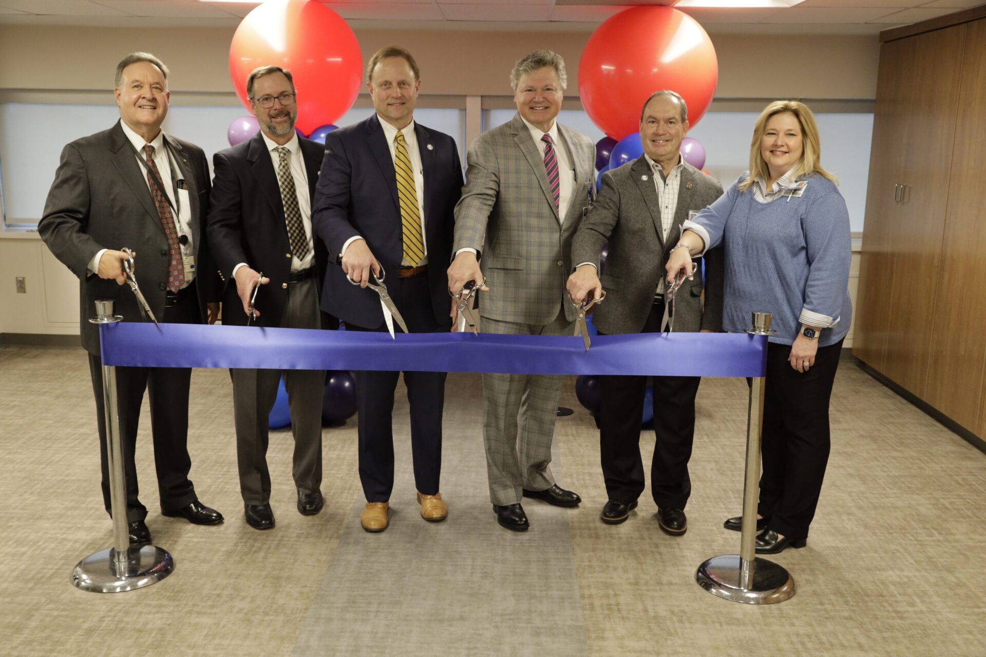 Covenant Health leaders cut blue ribbon