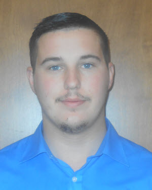 Corey Hopson_Transporter Team Lead Transporter dressed in blue polo.