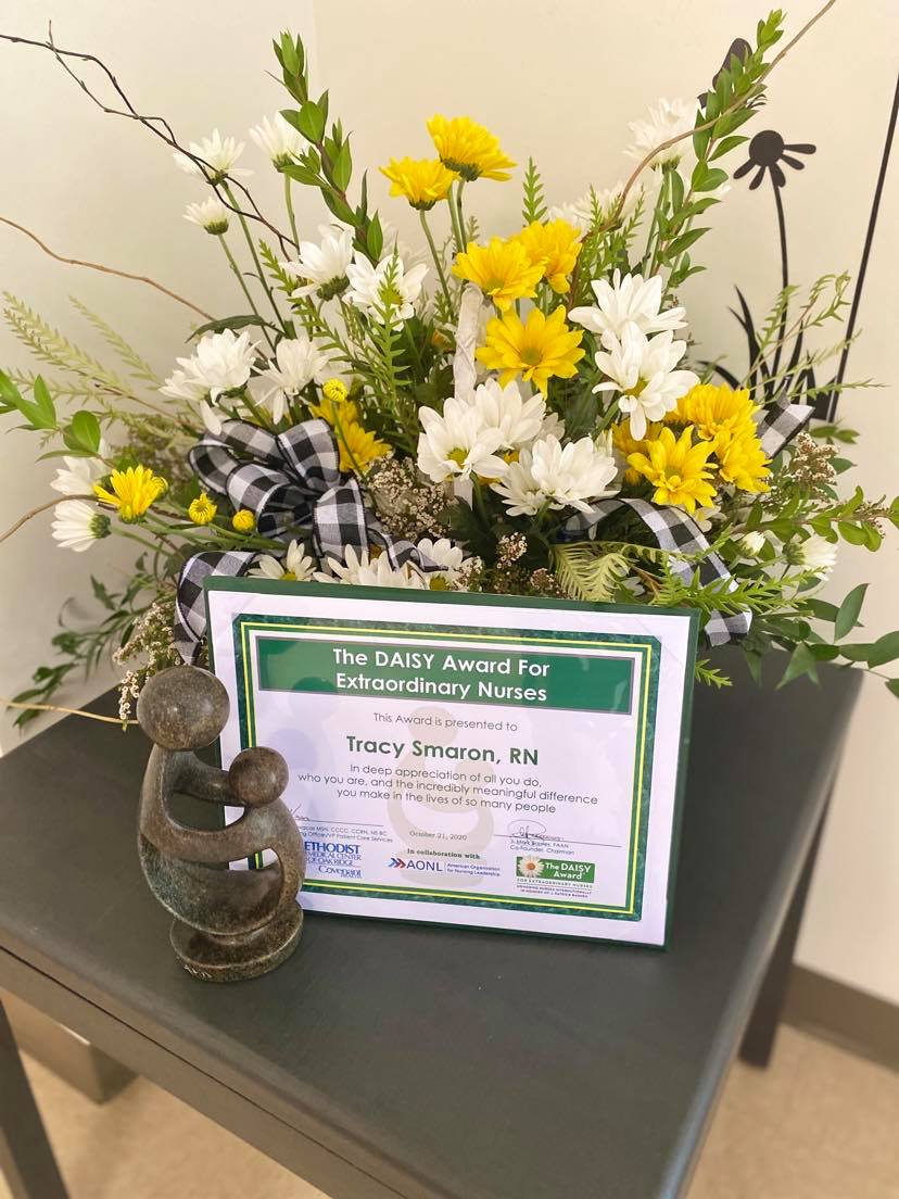 As a part of Tracy Smaron's DAISY award she received certificate, beautiful arrangement of flowers and a handcrafted sculpture entitled "The Healer's Touch."