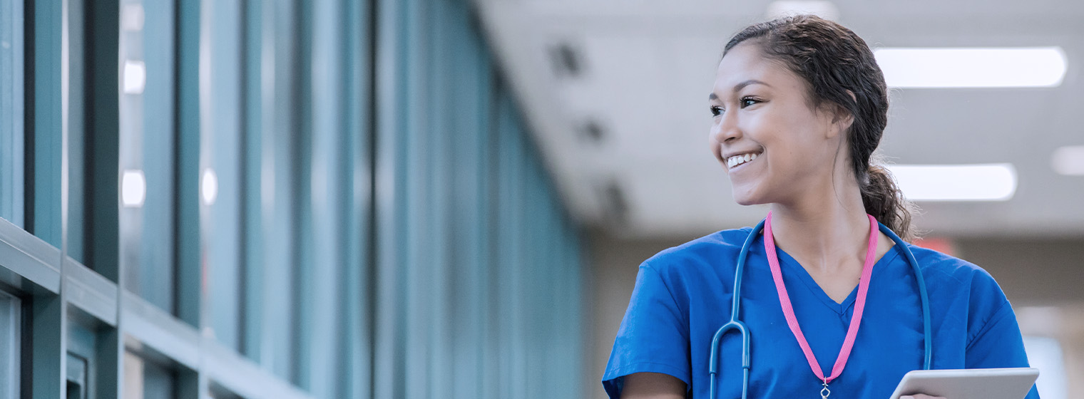 young female nurse looking to the side and smiling