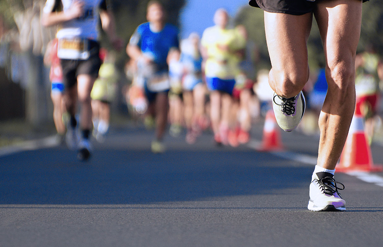 group of people running in marathon