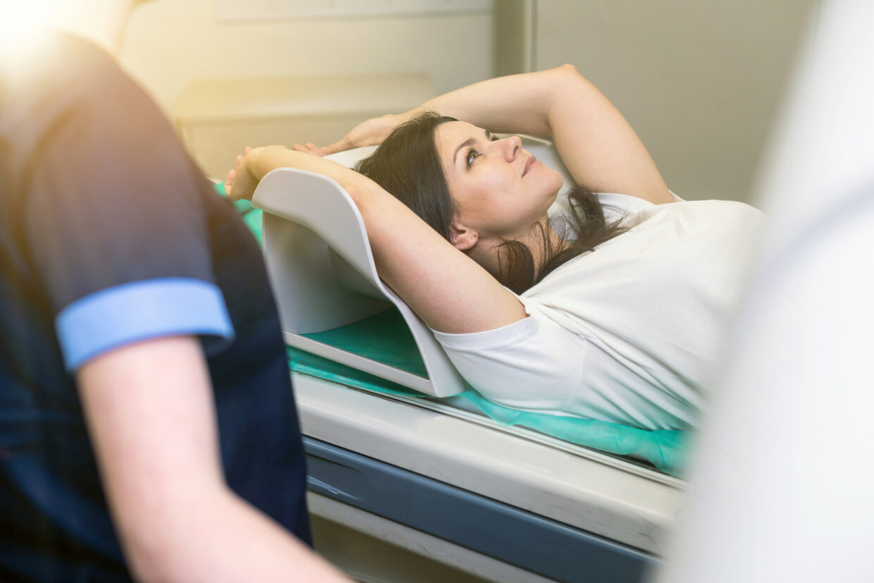 Lady being scanned for diagnostic imaging