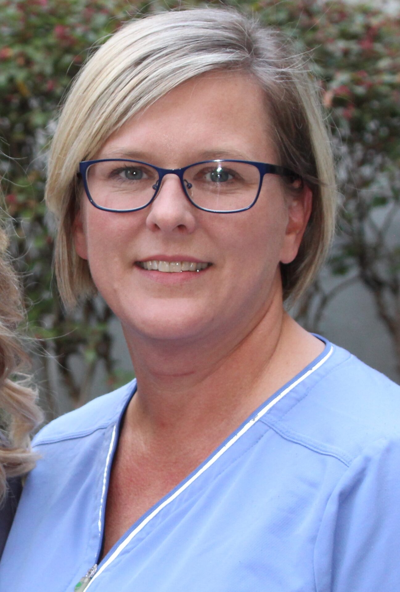 Misty Windle current in blue scrubs.