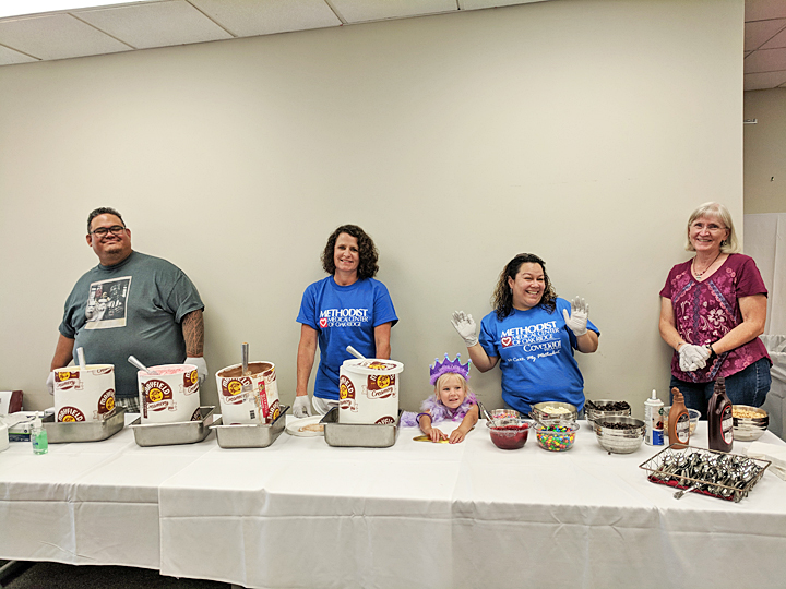 Ready to scoop! Volunteers serve up ice cream and smiles at Survivor Sundae.