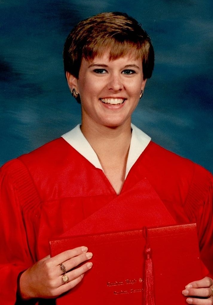 TBT: Misty Windle in red graduation gown holding diploma.