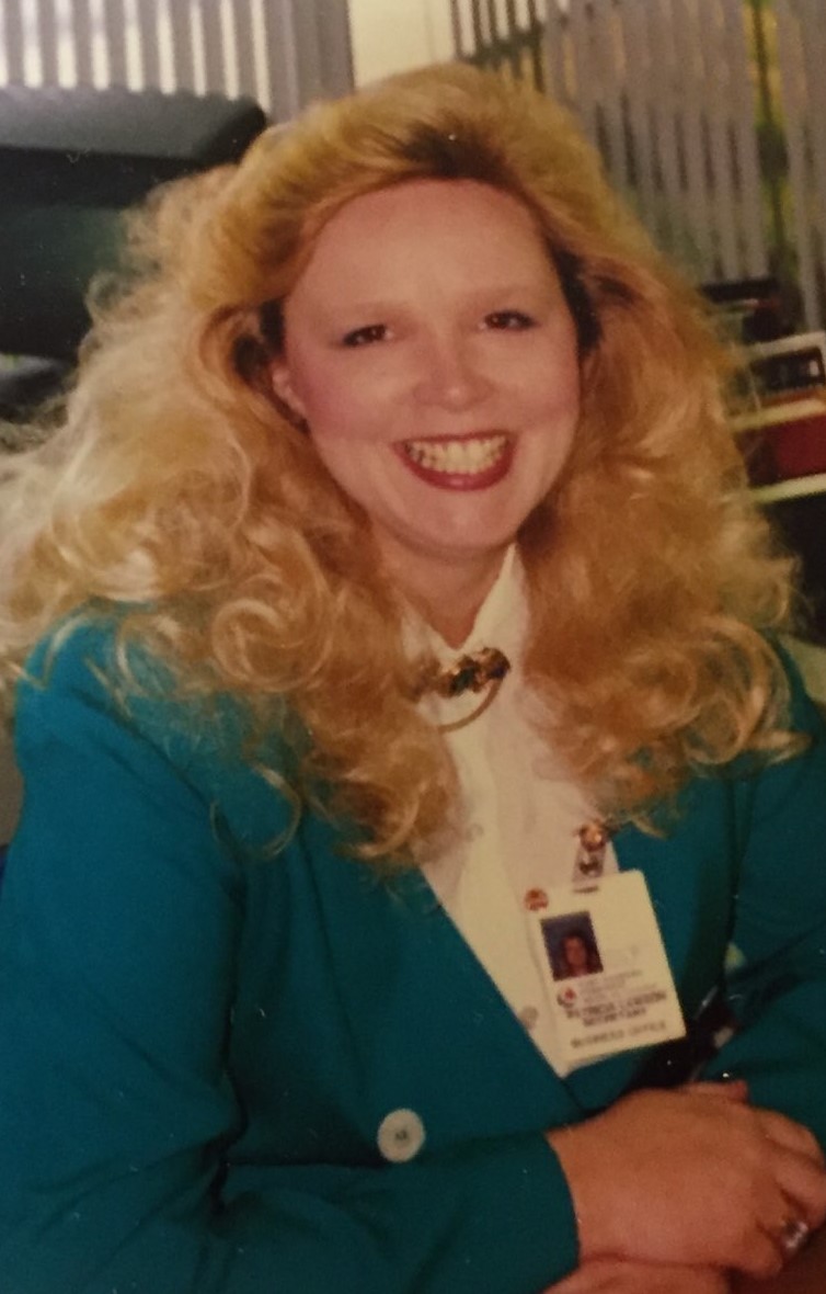 TBT phot of Trish Lawson in teal jacket, smiling
