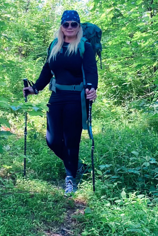 http___graphicservices_ColdFusionApplications_CovGraphicServicesJobBag_Jobs_Attachments_webtemp_0813-3787 WSSN Kelly McCarter KOC - FF Run Date 6.23 Kelli in hiking gear with hiking polls.