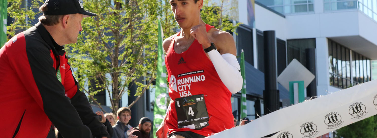 Marathon-runner-crossing-finish-line