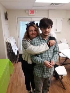 Cardiac patient, Kristi, hugging her son, who saved her life