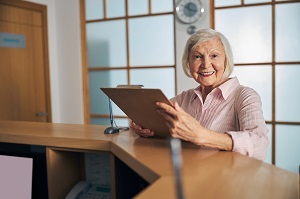 female patient checking in at doctor's office