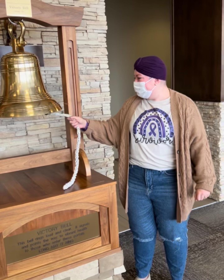 Logan Sluder rings the bell after successfully receiving proton therapy treatment for Hodgkin lymphoma at Thompson Proton Center. 