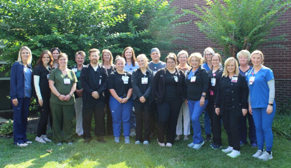 Members of the stroke team lined up outside for photo.