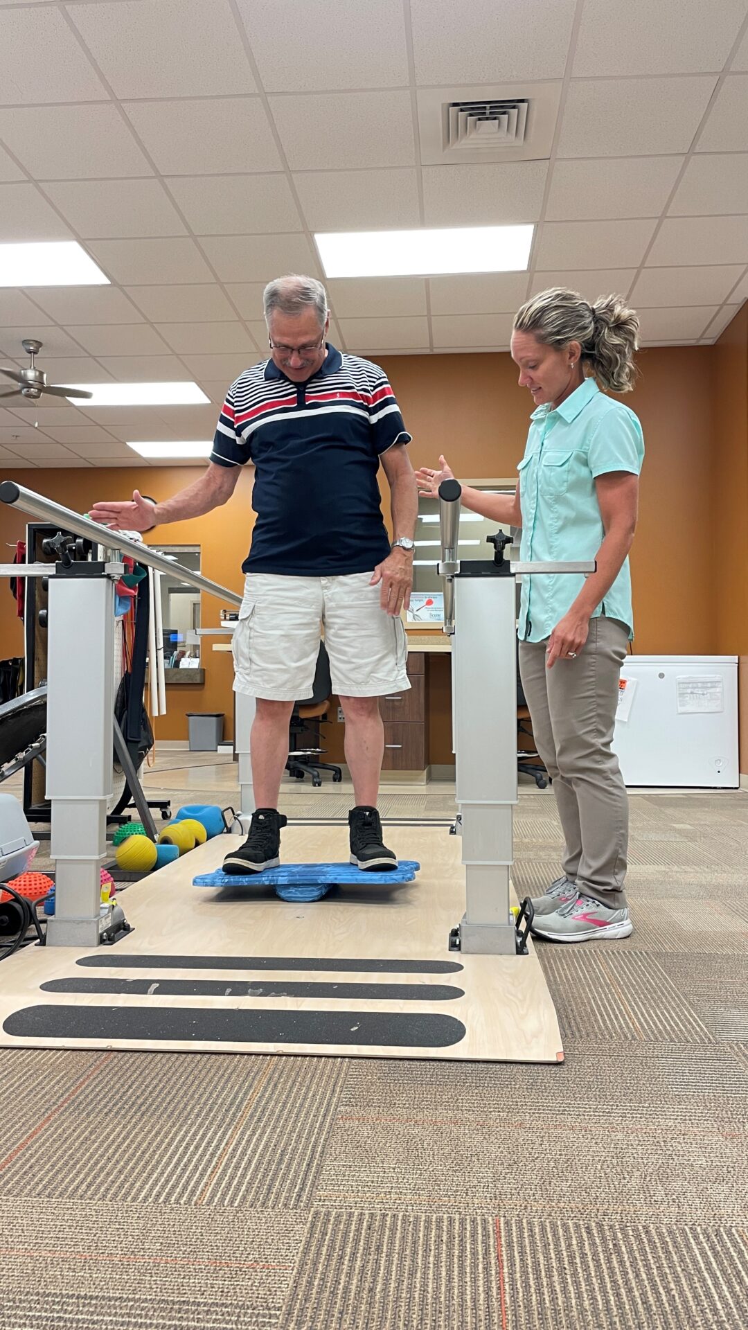 Katie Radke, physical therapist at Covenant Health Therapy Center - Harriman, puts patient Darrell Whaley through some balancing exercises.