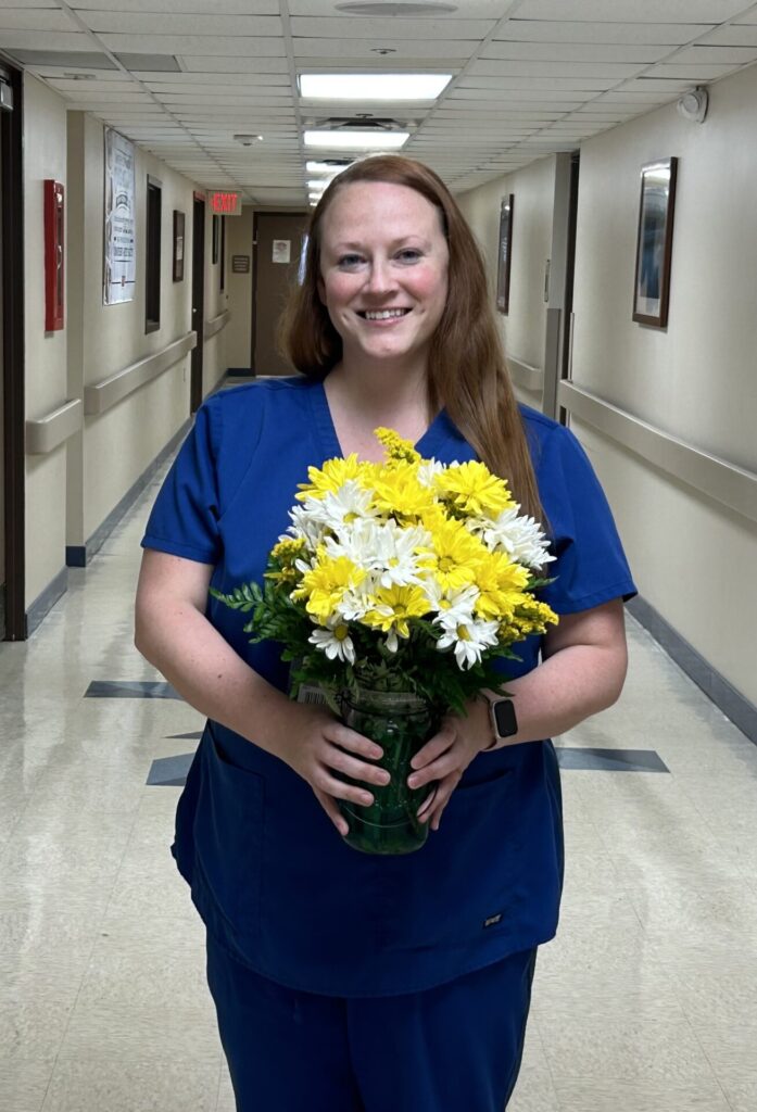 Emily pictured her DAISY bouquet after receiving her award.