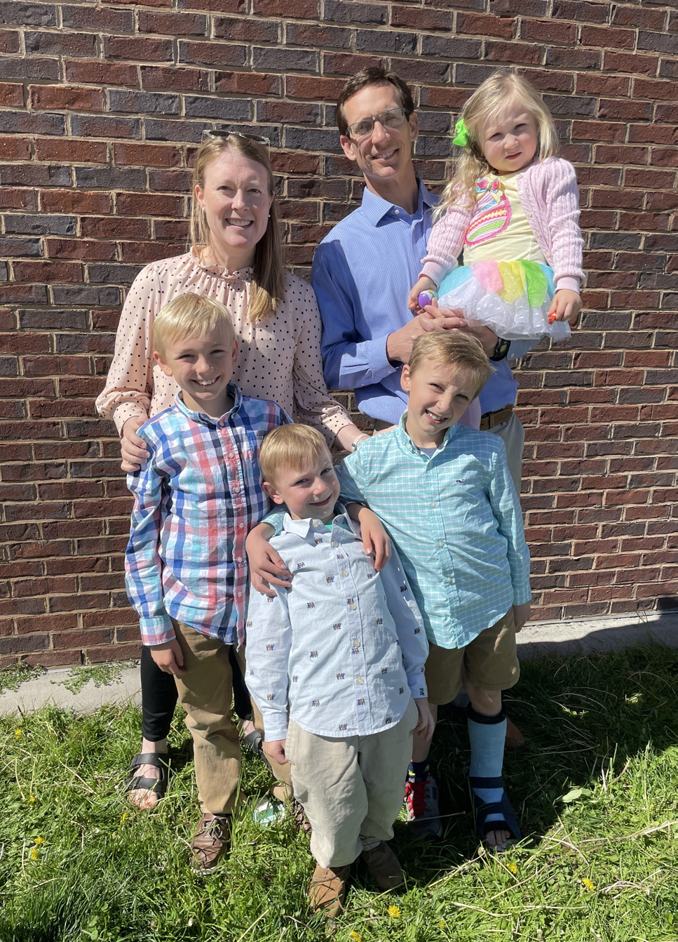 Johnson family dressed up and smiling.