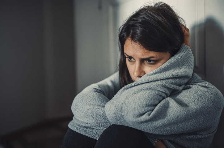 young woman looking sad