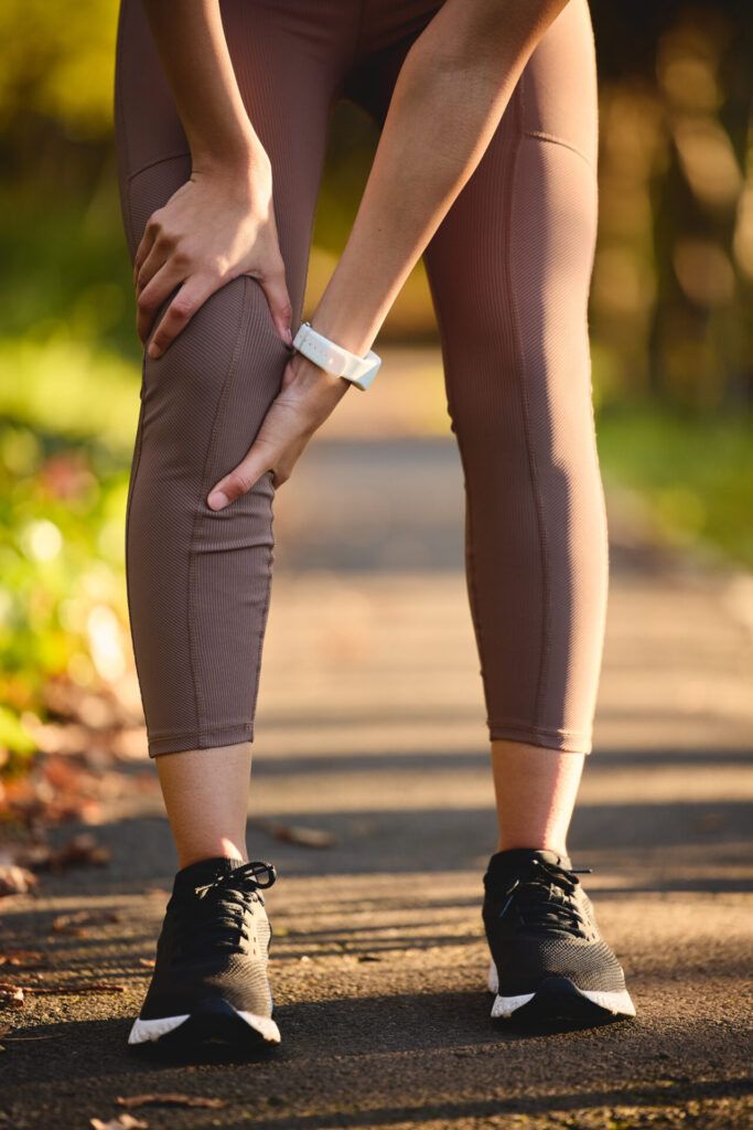 Woman-holding-painful-shin-and-knee