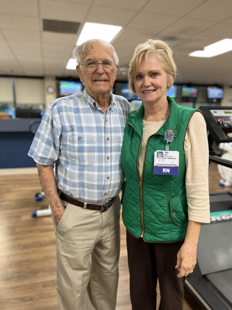 Jim-Jackson-standing-with-nurse-at-cardiac-rehab-gym
