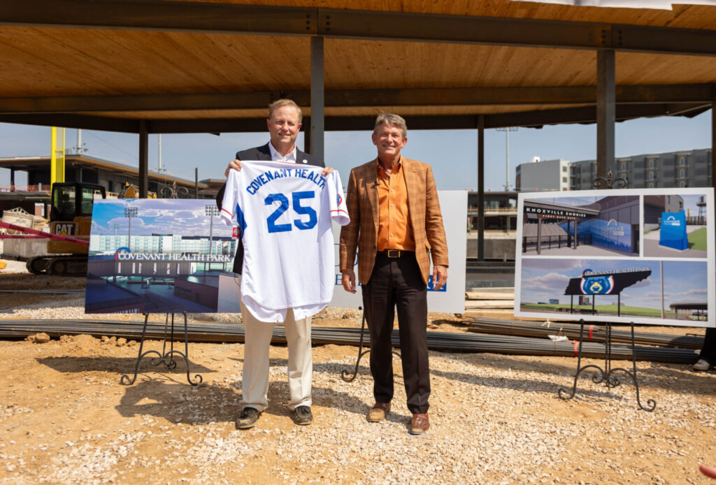 Randy Boyd, owner of Boyd Sports, smiles with Jim VanderSteeg, president and CEO of Covenant Health.