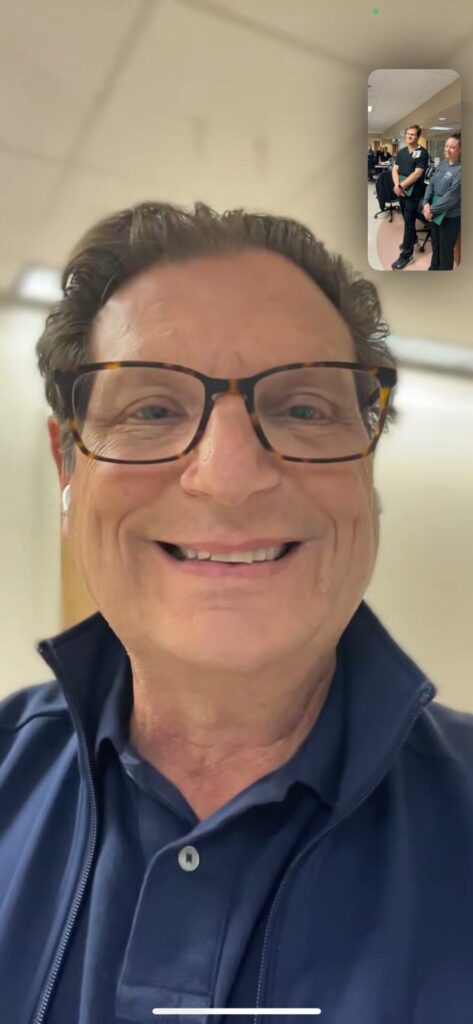 Smiling man on Facetime call