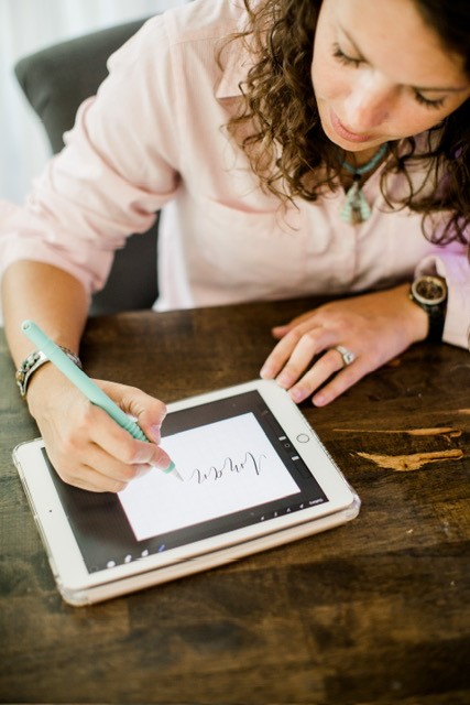 Erin Albright, instructor of Peninsula's calligraphy program, demonstrates a style of lettering using an electronic tablet