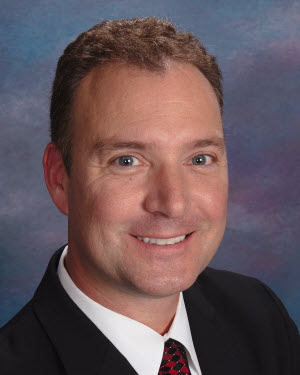 Headshot of David O'Brient in a suit and tie.