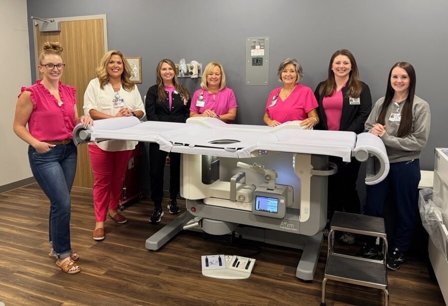 seven women standing with the new sterotactic biopsy table