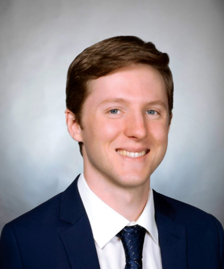 A portrait photo of Dr. Devon Davis wearing a suit and tie.